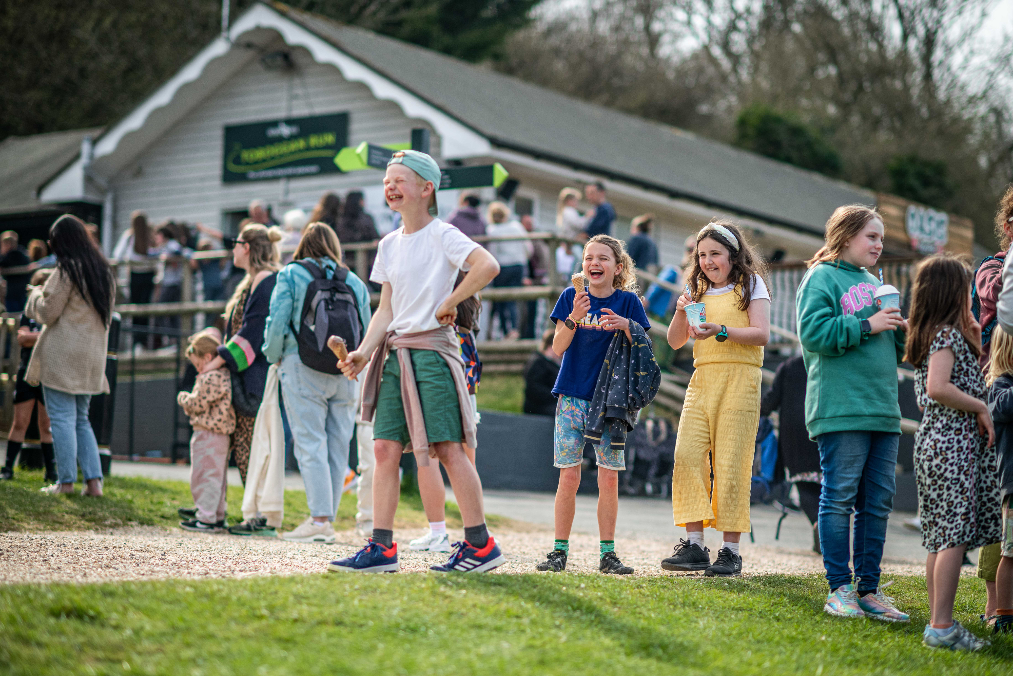 Children laughing at Robin Hill Adventure park holding ice creams